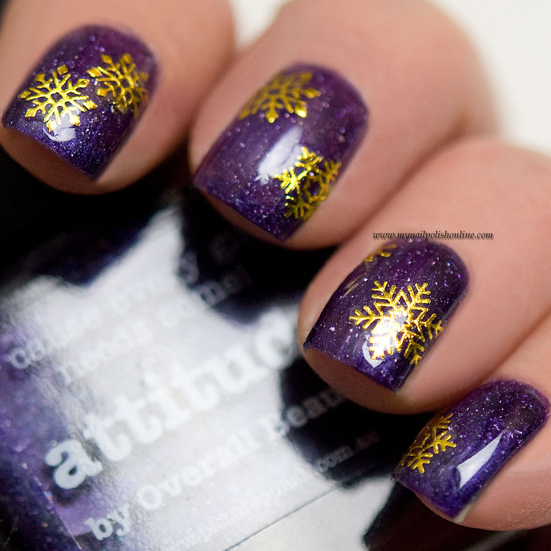 Golden snowflakes over purple